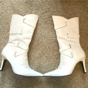 Pointy-toed below-the-knee Leather boot. Slightly worn. Snug fitting